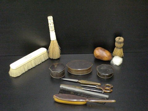 Lot of 12 mens personal grooming tools: three con: Lot of 12 mens personal grooming tools: three containers, 4 grooming/ shaving brushes, 3 tools, (pick, scissors, file), 1 comb, 1 pumice tool.