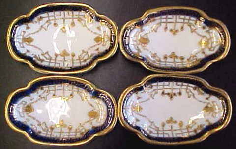 Set of 4 Elegant Hand Painted Nippon Salt Trays: Set of 4 Elegant Hand Painted Nippon Salt Trays/Dips. Trays are trimmed in Raised Gold with a deep cobalt blue rim. All four are in EXCELLENT CONDITION and measure 3 1/2" long and are 2 1/4" wide.