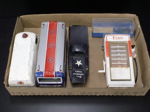 Miscellaneous box lot of metal toy trucks: Esso g: Miscellaneous box lot of metal toy trucks: Esso gas pump, Navy 3rd Amphibious Force truck, blue and red, an American Airlines bus, white Volkswagen ambulance, made in Japan, 3 little cars.