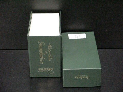 2 Dept. 56 Snowbabies: Lot of 2 Dept. 56 Snowbabies, bisque ornament (#68470) and Winter Tales of the Snowbabies, "Hold on Tight" snowbaby sledding, (#7956-1).