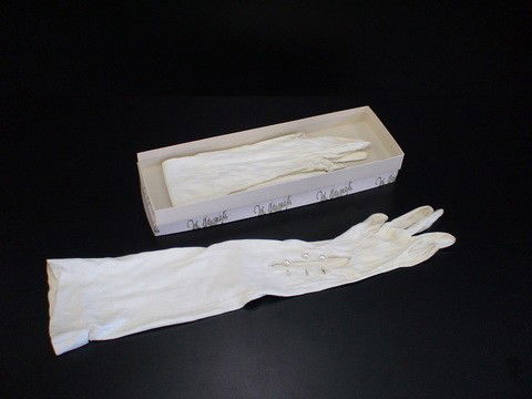 White kid gloves with pearl buttons in John Wanam: White kid gloves with pearl buttons in John Wanamaker box.