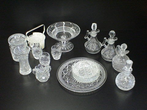 Lot of 15 cut and pressed glass: 4 cruets, set of: Lot of 15 cut and pressed glass: 4 cruets, set of 6 coasters with container, 3 dishes, 1 mustard pot, toothpick holder, 3 shot glasses, 1 vase, 1 candy dish on pedestal.