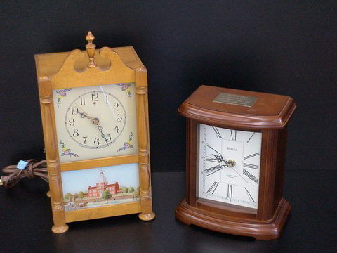 Lot of 2 clocks: Commemorative Bulova battery ope: Lot of 2 clocks: Commemorative Bulova battery operated clock, Westminster Melody 7 1/2" x 10" and Pillar and Scroll type electric clock, Revere Westminster Chime Telecron Motored, 8" x 16".