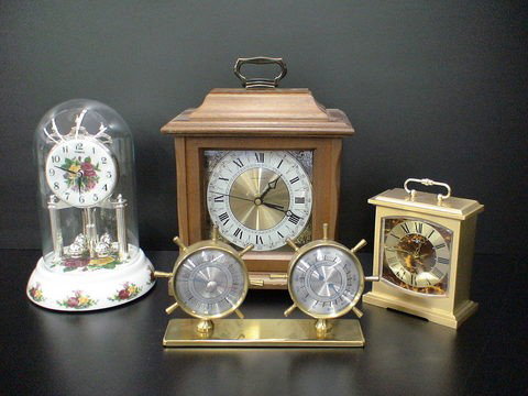 Lot of clocks, Hamilton clock with wood case, 9x5: Lot of clocks, Hamilton clock with wood case, 9x5"L x 5"W x 9.5"H, Howard Miller Quartz clock, metal case, 4.5"L x 2"W x 5"H, Timex dome clock, 6"D, & Swift Instruments thermometer & barometer, 8"L x 