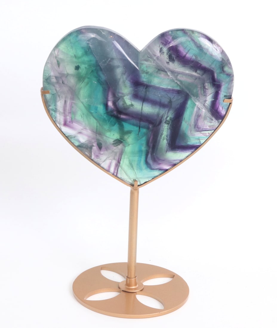 Stunning Natural Rainbow Fluorite Heart on Stand: Beautiful all natural rainbow fluorite mineral specimen perfectly polished and shaped into a heart. Natural bright green to deep purple coloring throughout. Natural inclusions make the piece glisten