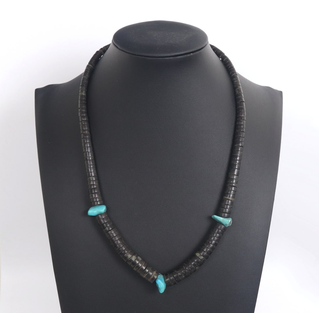 Shell and Turquoise Necklace: Nicely crafted shell and turquoise necklace with hook loop clasp. Three chunky pieces of turquoise accent against the deep brown shell disc beads. Size 18" L