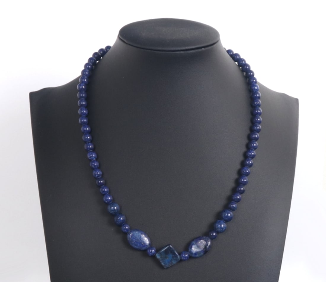 Wonderful All Natural Lapis Lazuli Beaded Necklace: Wonderful lapis lazuli beaded necklace with spherical and free form beads. Beads have natural gold and silver speckles throughout each bead, strung together with a deep blue silk thread. Size 18" L