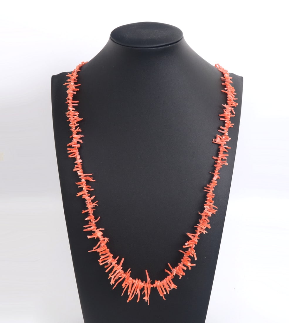 Lovely Light Pink Coral Necklace: Wonderful angel pink coral necklace with dozens and dozens of unique free form pieces of coral. Long terminals with smaller chunky beads in between. Light pink to natural coral color makes for a