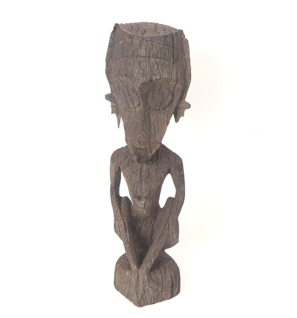 Borneo Ironwood Carved Guardian Figure: Unique anthropomorphic wood carved figure, Borneo. Teardrop shaped head with perfectly circular protruding eyes, pointed layered long ears with a pointed and jutting chin. Slender feminine frame with 