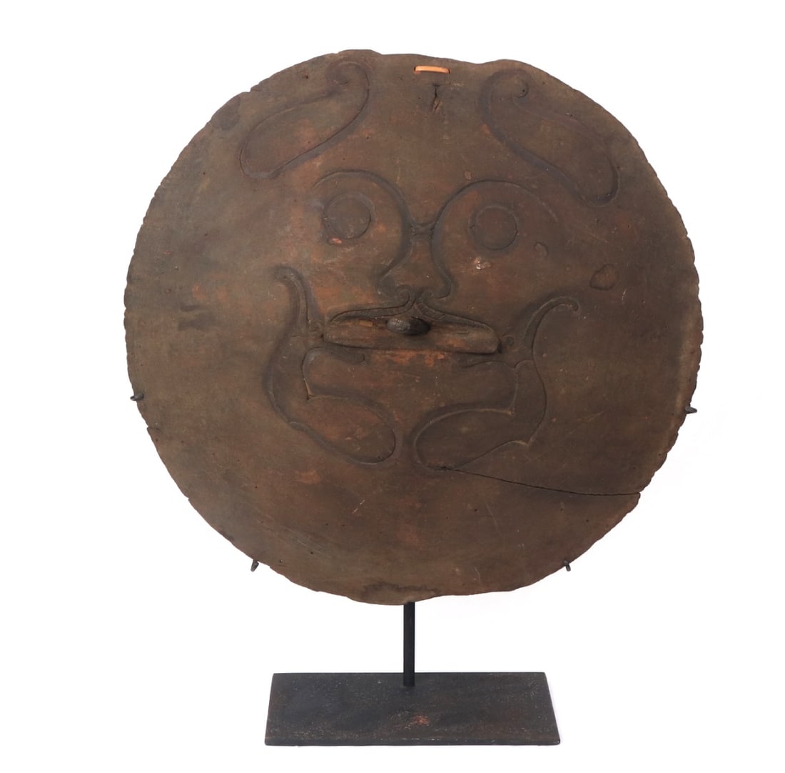 Handsome Borneo Wood Carved Lid with Stand: Large wood carved lid with incised zoomorphic figure to the face and moveable handle with a humanoid figure incised. Due to the size the lid was likely use for larger storage vessels for grains or sta
