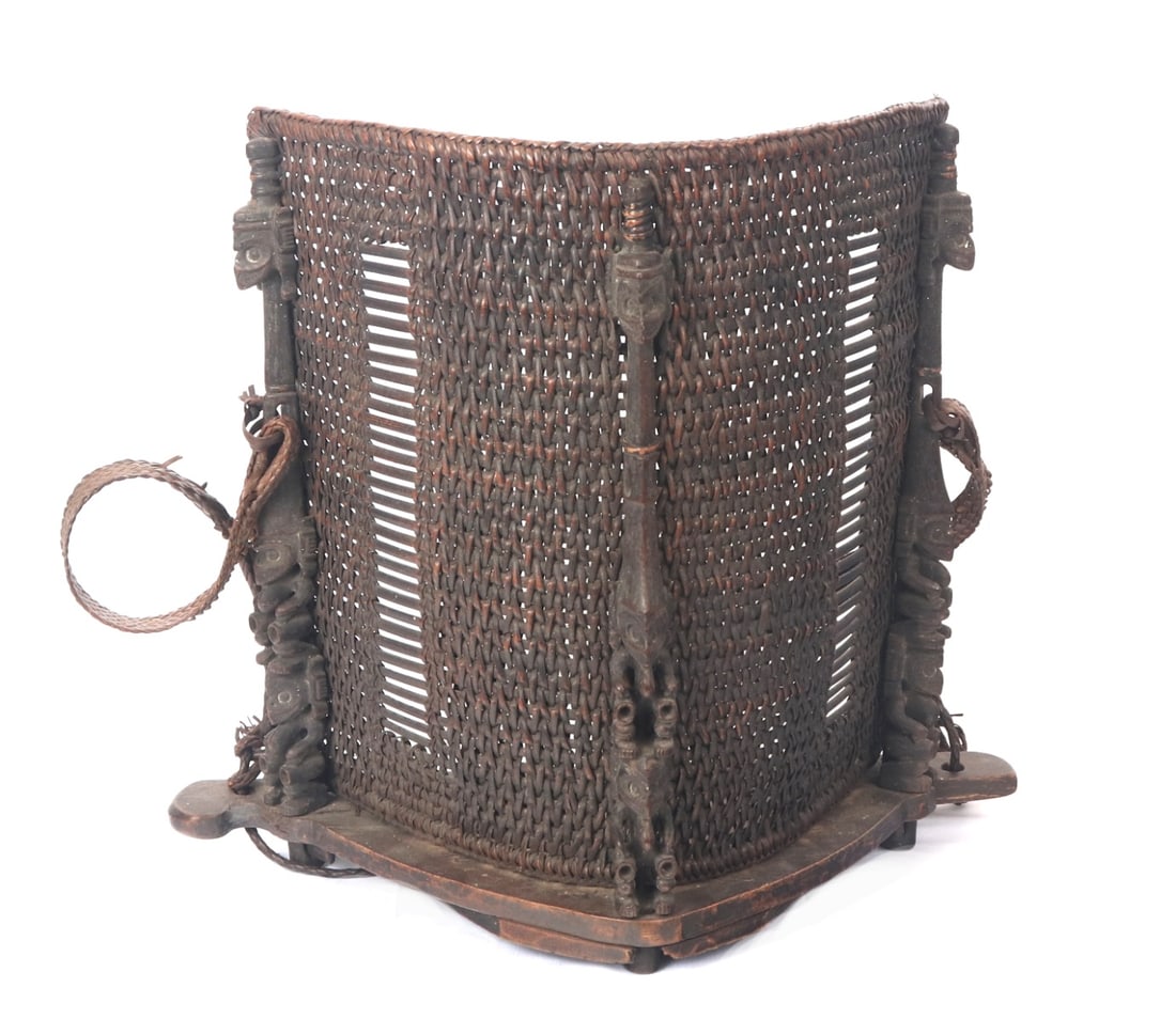 Gorgeous Filipino Handmade Rattan Woven Baby Carrier: Incredibly handcrafted baby carrier from the Philippines. Rattan woven barrier where the baby would rest against, with rattan braided straps. Intricately carved wood guardian totem like figures