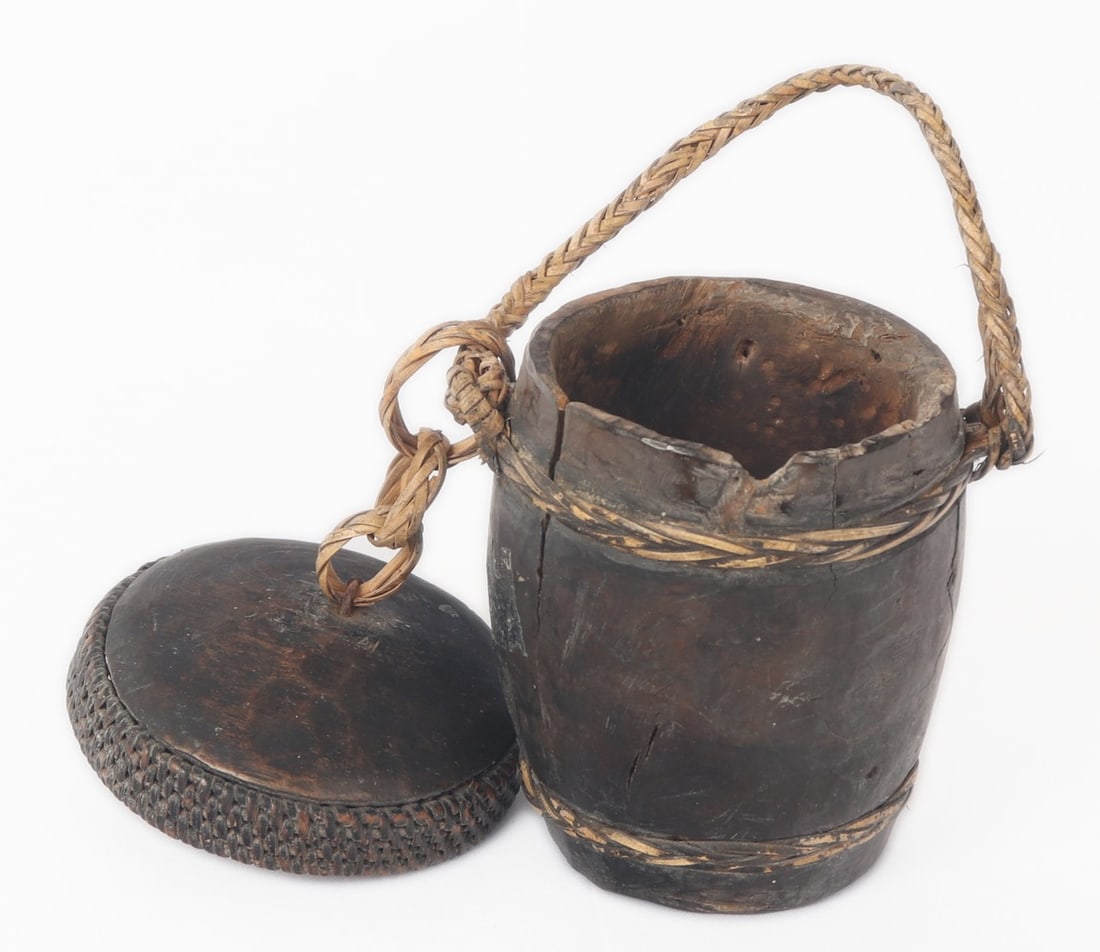 Adorable Miniature Canteen or Spice Cup, Philippines: Petite Filipino personal canteen or spice container from the Philippines comprised of rattan and a solid hard wood, likely Narra wood. Braided rattan carrying handle in a light blonde color. Size appr