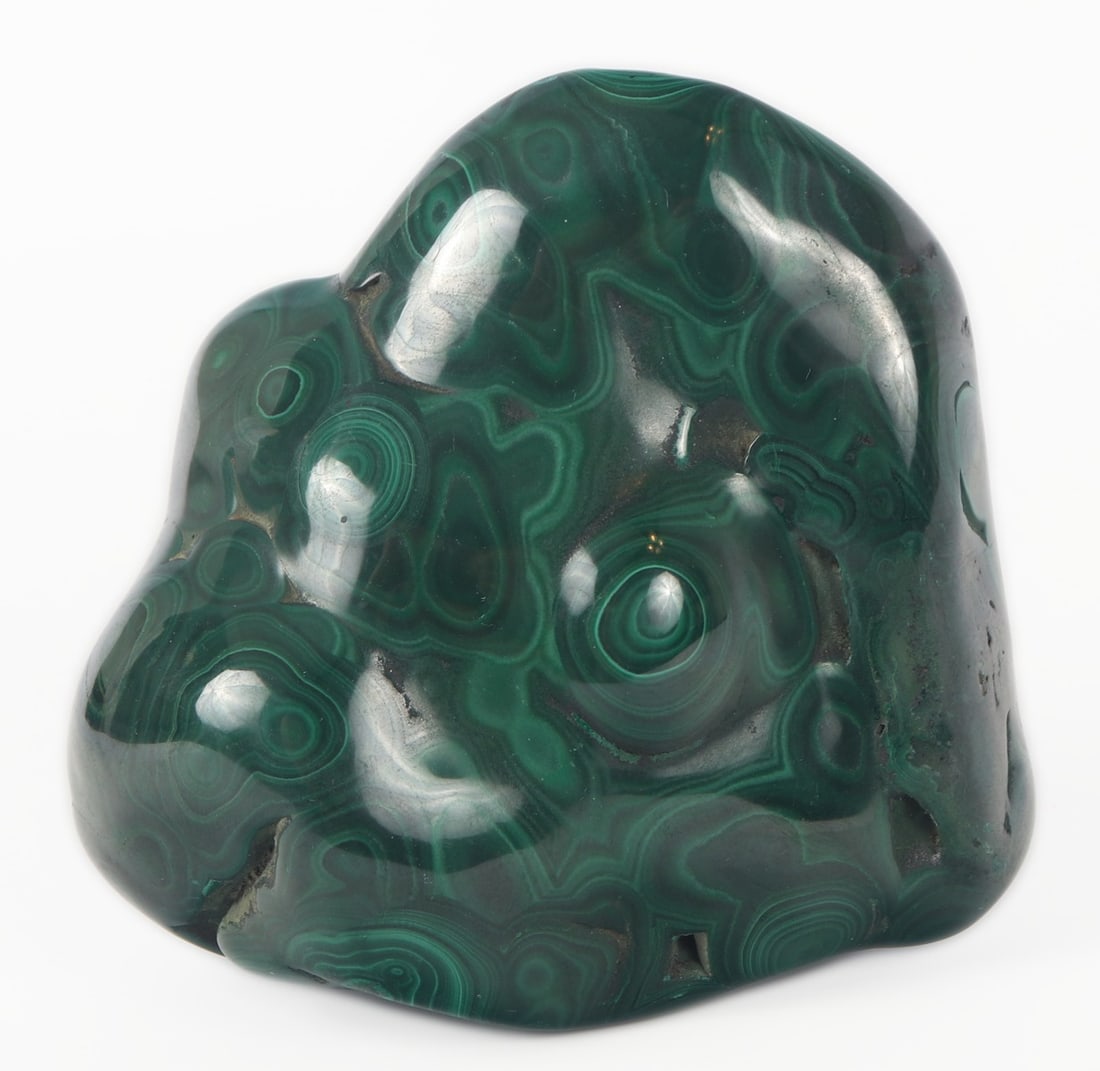 Wonderful Freeform Malachite Mineral Specimen: Gorgeous dark green malachite mineral specimen in a lovely polished freeform. Beautiful small bullyseye sections highlighted by bright light green banding. Even for it's small shape and appearance it 
