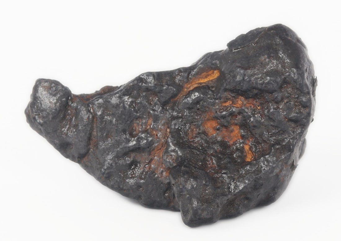 Fine Ancient Nantan Meteorite, 82 Grams: Wonderful ancient Nantan Guangxi, China meteorite formed millions of years ago. Oblong free form shape almost similar to a whale or a dolphin arched in the air after shooting out of the ocean. Fine ir