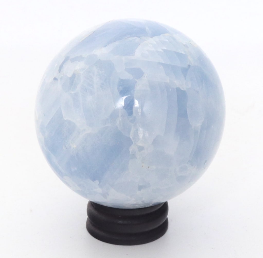 Lovely Light Blue Aquamarine Mineral Sphere on Stand: Beautiful light blue aquamarine mineral specimen with lovely ancient crystallizations throughout. Natural rock salt like formations with a perfectly polished surface. Size: 2 1/2" H on stand