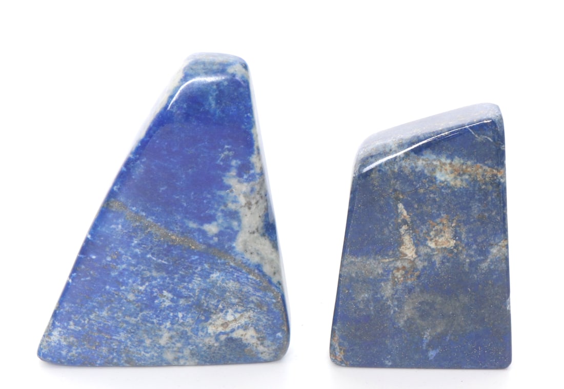Pair of Lapis Lazuli Miniature Bookends: Lovely pair of natural lapis lazuli mineral slabs in a small free form shape. Natural dark blue coloring mixed with natural gold and silver flakes throughout. Wonderful natural sparkle when in natural
