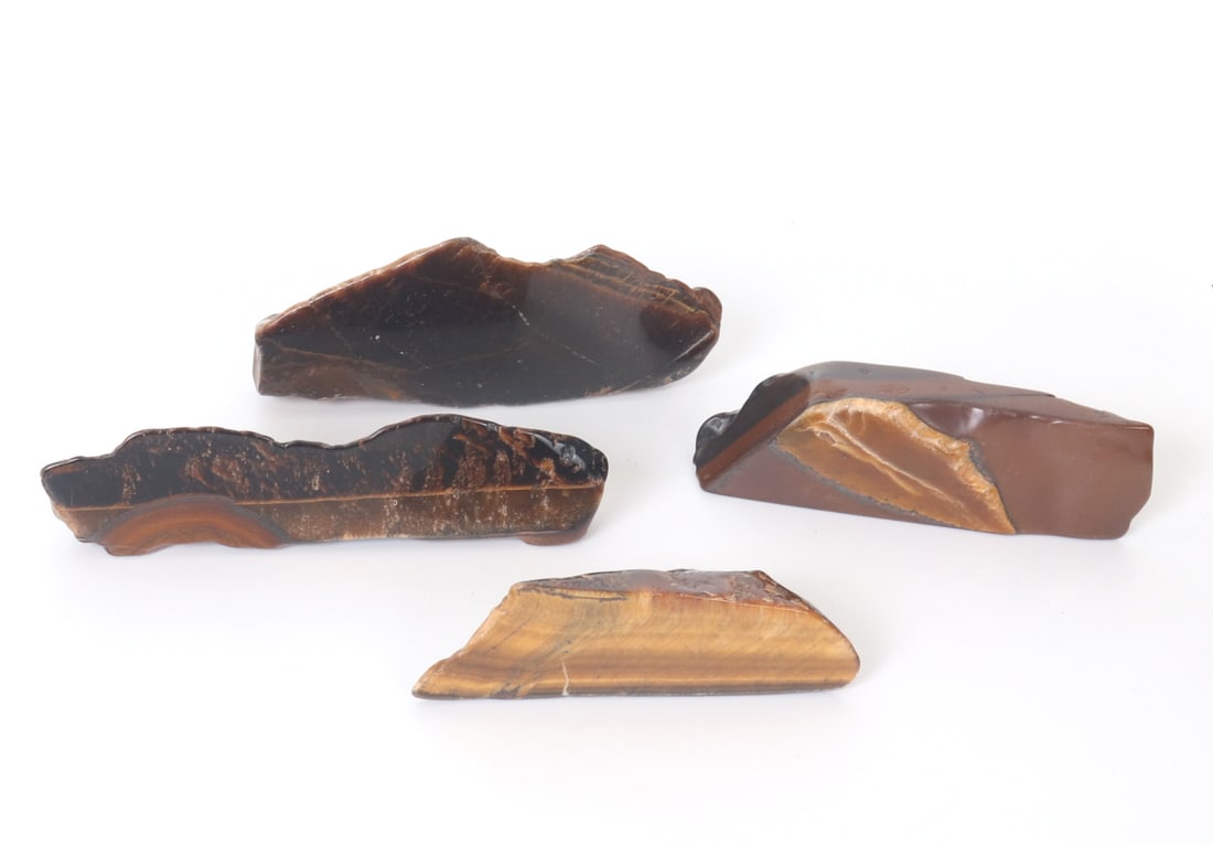 Group of Four Freeform Tiger's Eye Slab Sections: Fun group lot of four sections of freeform tiger's eye slabs with natural caramel and gold striping throughout each piece. All in rough cut form with softly polished edges and buttery smooth surface. 
