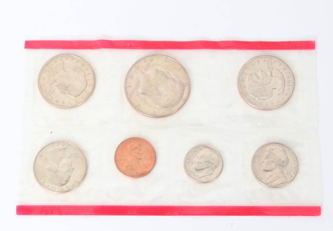 Collection of 1981 American Coins: Well preserved group of 1981 near mint condition coins. Lot includes a penny, nickel, dime, quarter, half dollar and dollar coin. Size: Set in plastic 5 1/2" W x 3" H