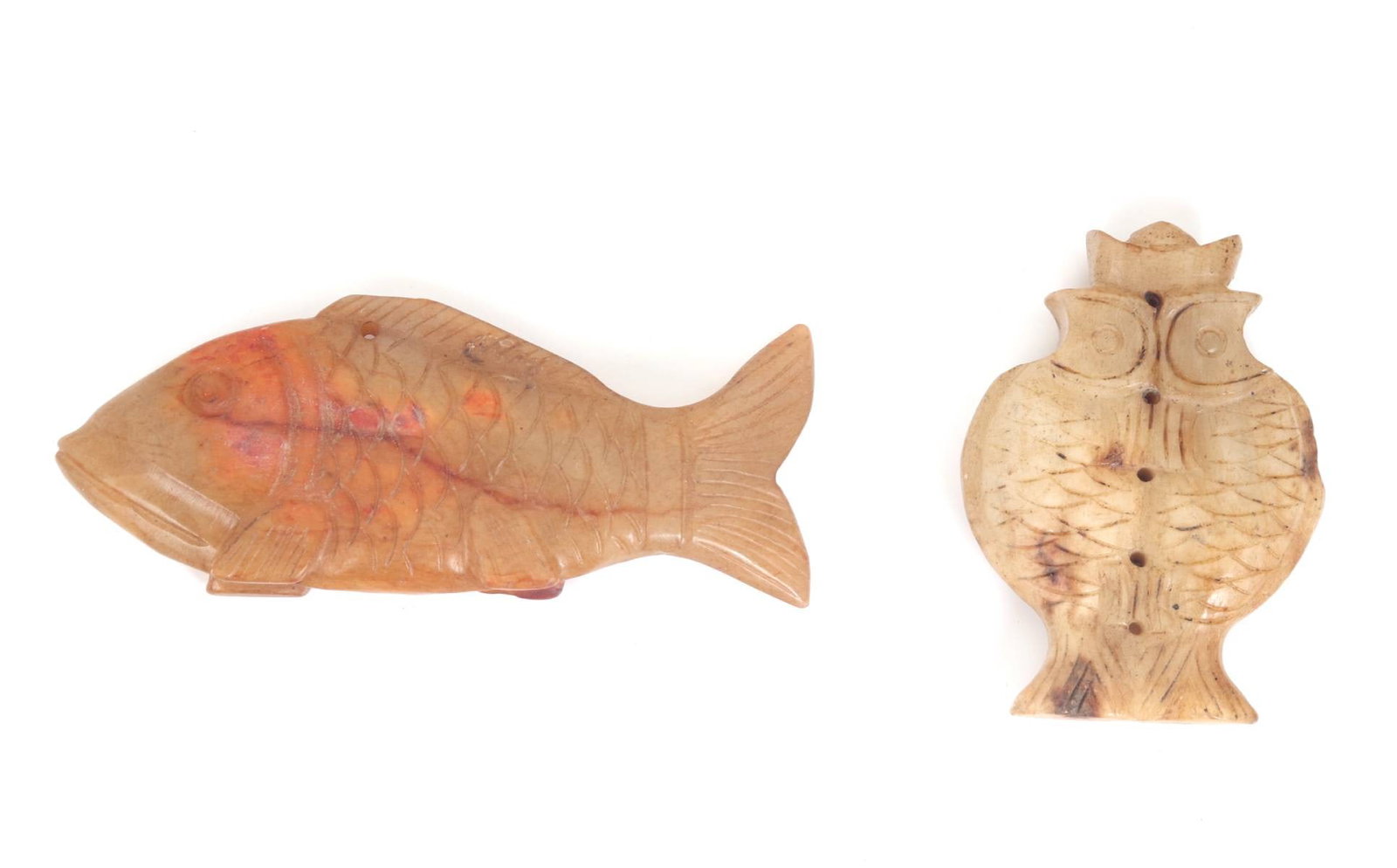 Lot of Two Chinese Hardstone Fish Carvings: Group lot of two Chinese hardstone jade style figures in fish forms. Each stone uniquely colored with the larger 'standing' fish with hues of orange and red with light cream translucency in areas. Dou