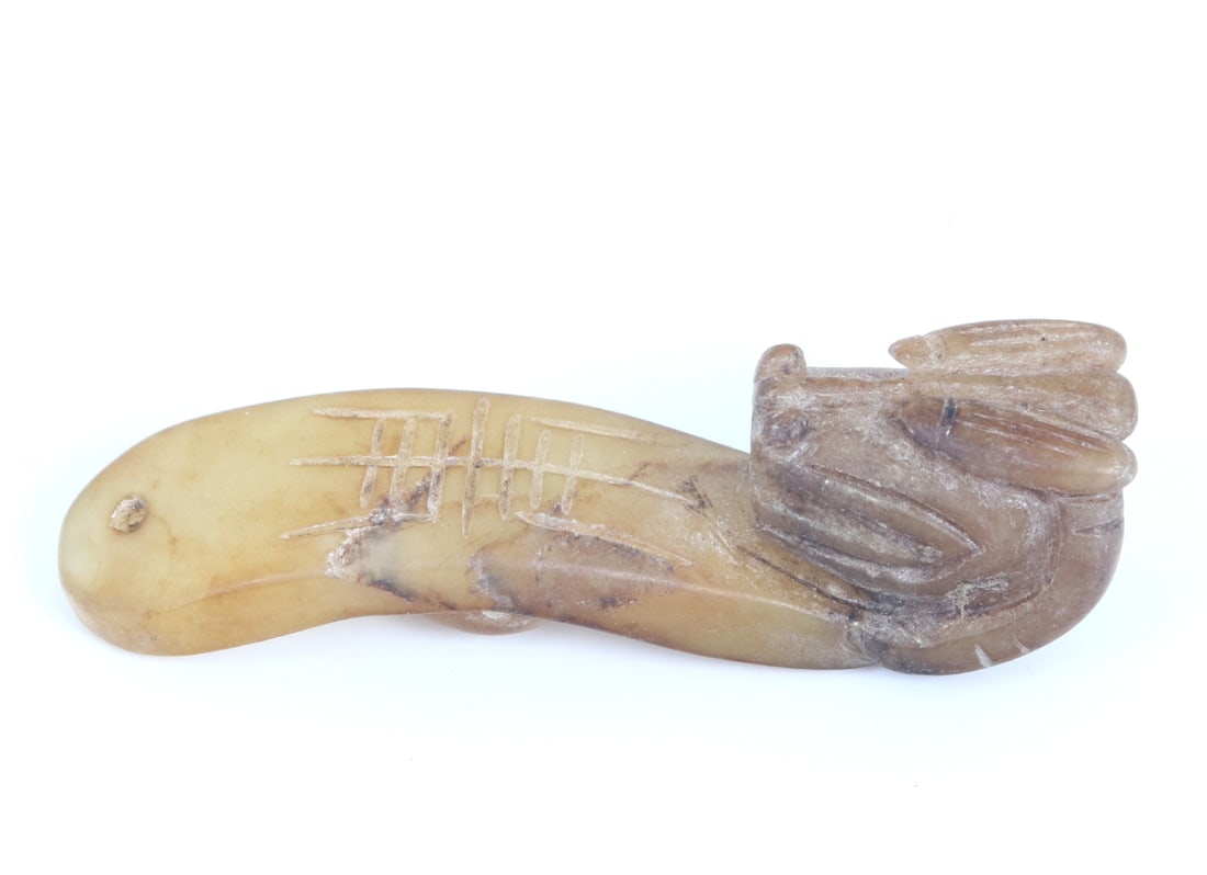 Chinese White Jade Style Dragon Belt Hook: Adorable miniature white jade style Chinese belt hook in the shape of a dragon. Stone in a creamy white stone with brown hues throughout, incised symbol to the face and drilled to the base for suspens