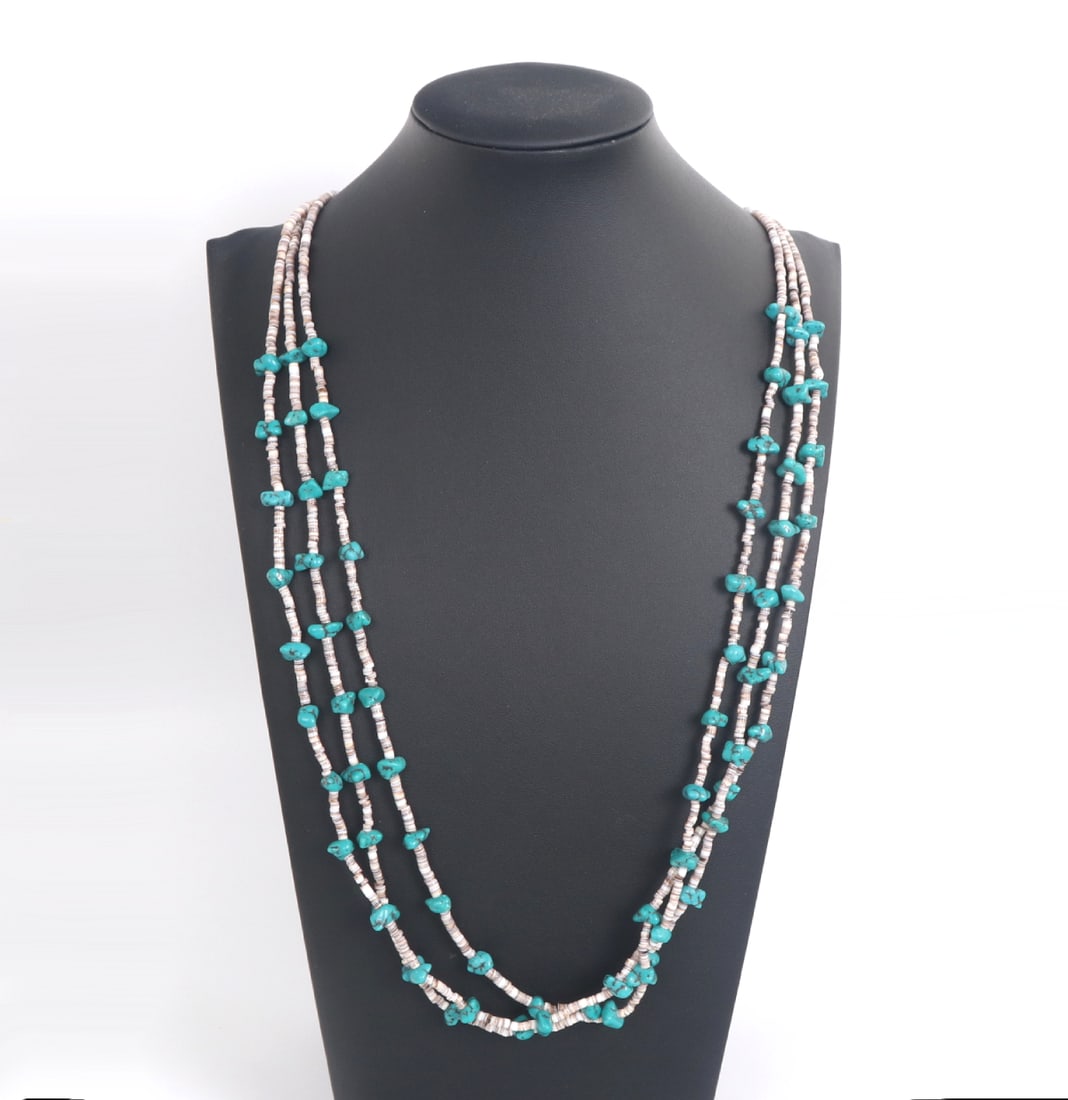 Beautiful Triple Strand Shell & Turquoise Necklace: Stunning three strands of shell and turquoise beads in a wonderful waterfall style. Tube accent beads at the clasp with hammered square details at the base. A beautiful addition to any jewelry