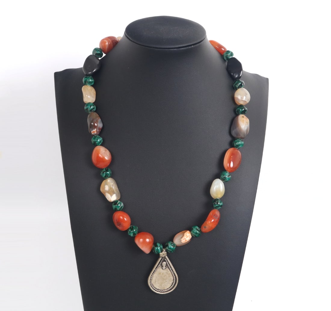 Wonderful Multi-stone Beaded Necklace: Very pretty multi-stone beaded necklace comprised of freeform malachite beads, orange, purple and crystal quartz agate beads, as well as two jet accent beads. Pendant in a teardrop shape with a