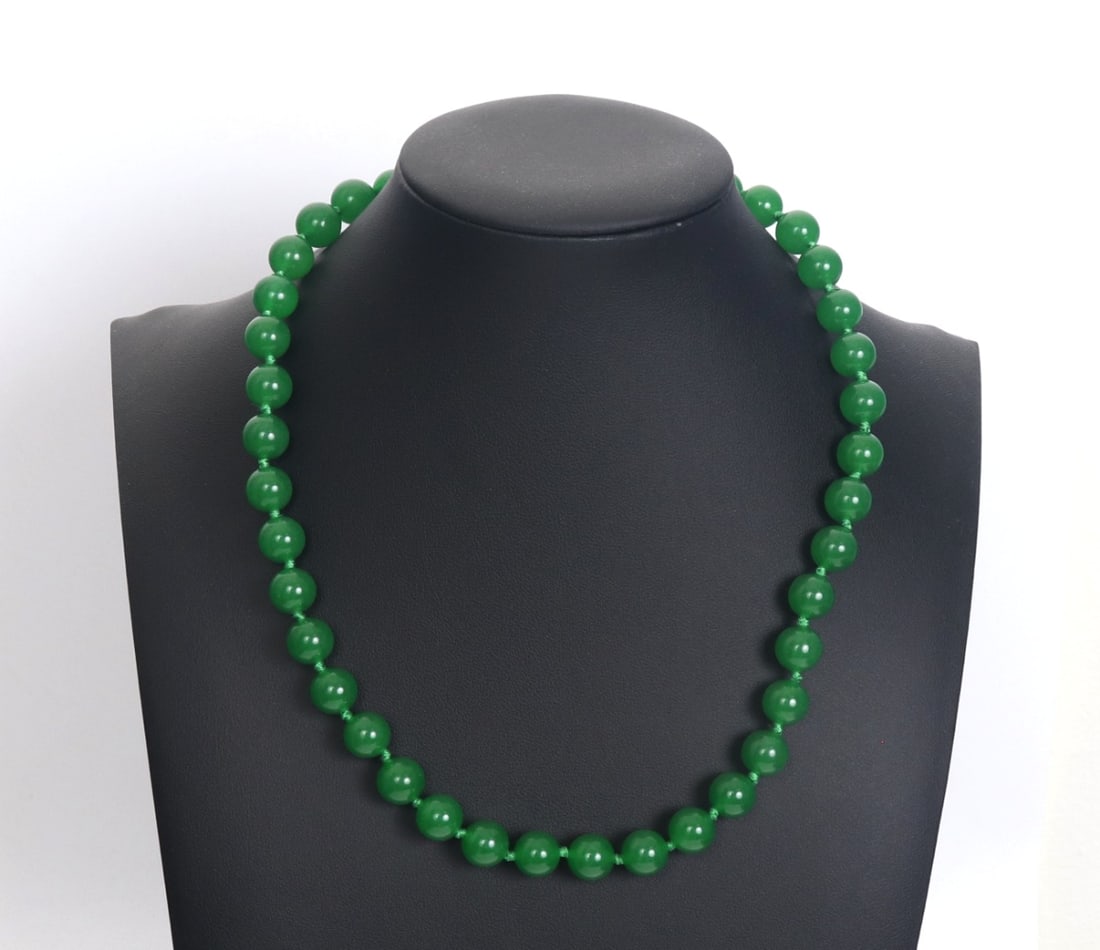 Beautiful Chinese Light Green Jade Style Necklace: Beautiful Chinese jade style beaded necklace in a short and dainty form. Small perfectly polished beads with tied green silk thread acting as spacer beads in between. Size 17" L overall.