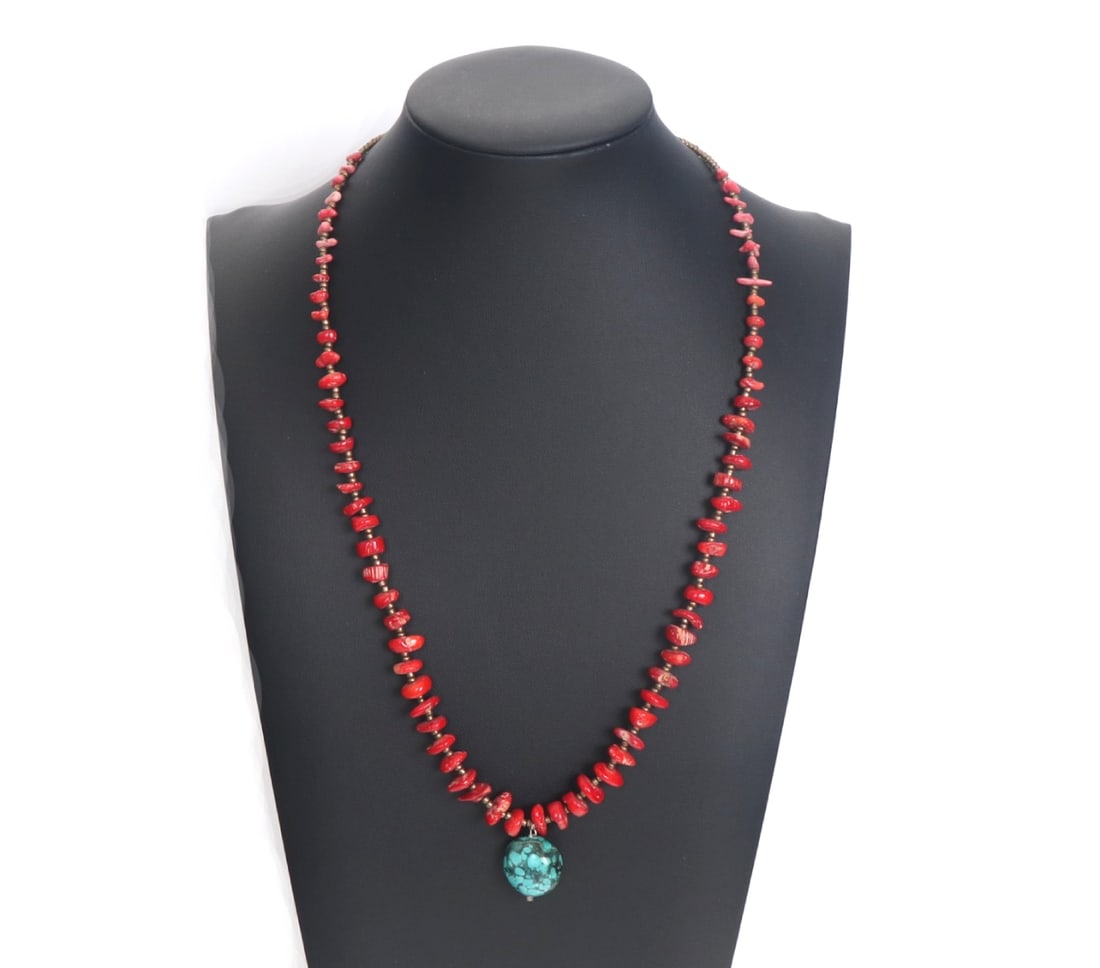 Beautiful Red Coral Necklace with Turquoise Pendant: Lovely red coral necklace comprised of dozens of pieces of red coral tumbled beads and a central turquoise bead in the center. Copper style spacer beads leading to the clasp. Size 21" L
