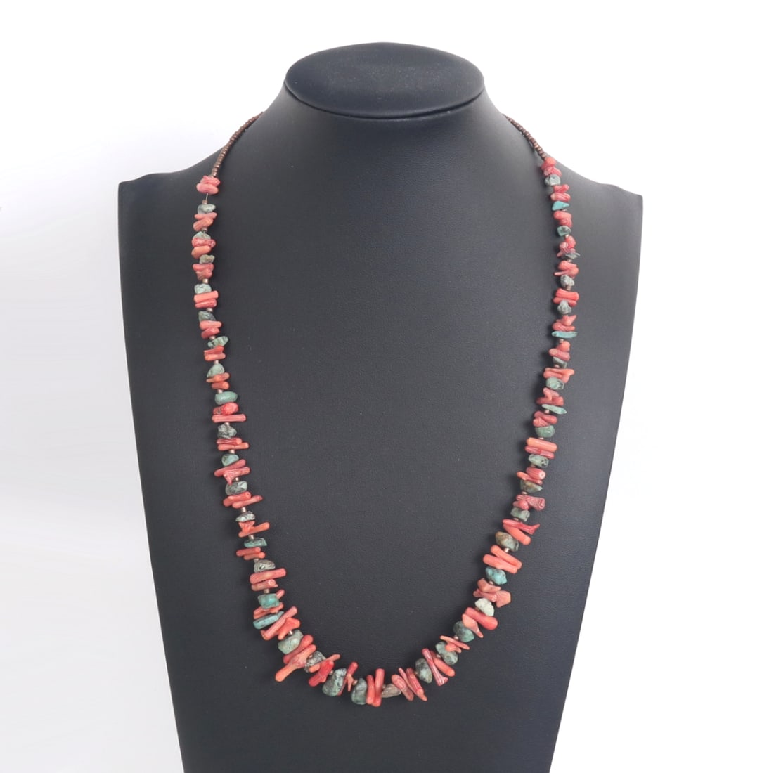 Red Coral & Turquoise Beaded Necklace: Beautiful red coral and freeform turquoise beaded necklace with dozens of red and pink coral terminals throughout with freeform turquoise accent beads in between. Copper style accent beads near the
