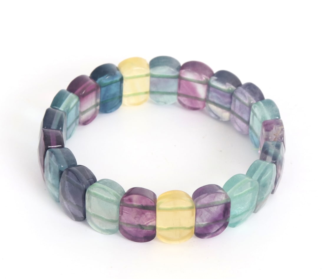 Lovely All Natural Rainbow Fluorite Bracelet: Wonderful all natural rainbow fluorite pieces perfectly polished and shaped for a beautiful beaded bracelet. Dark purple to light sunshine yellow with a lovely variety of green and turquoise in