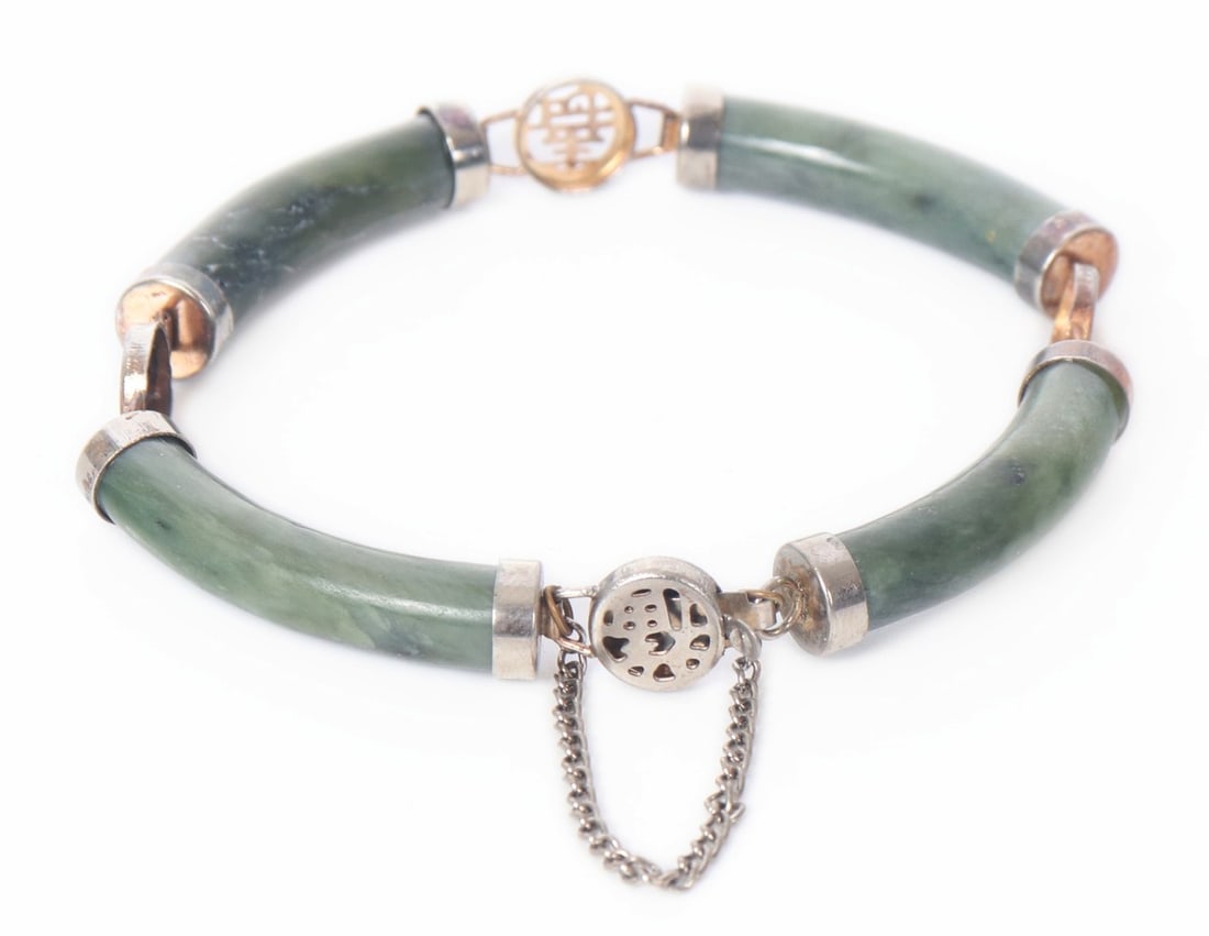 Chinese Jadeite Beaded Childs Bracelet: Beautiful Chinese jadeite beaded bracelet made for a child or a very small wrist. Four tube beads with four circular accent beads in a silvered metal. Size of inner diameter 2 1/4" W