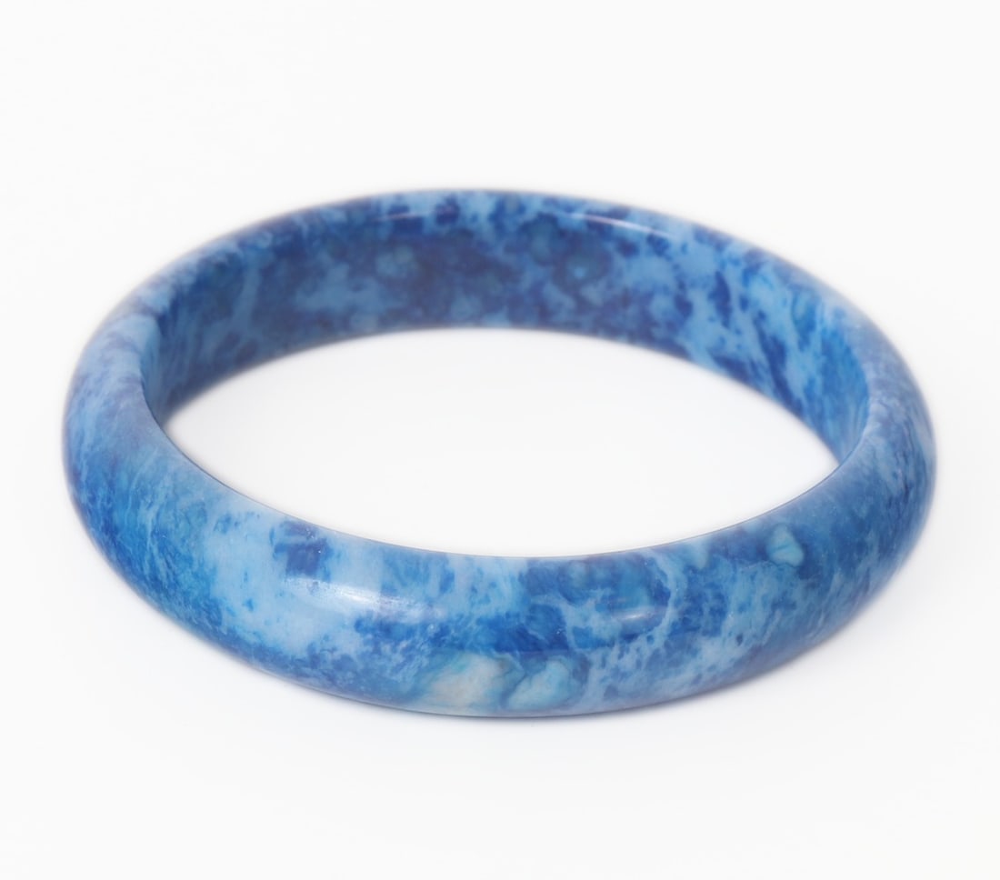 Gorgeous All Natural Lapis Lazuli Bangle Bracelet: Lovely all natural lapis lazuli mineral section shaped into a perfect bangle. Lovely bright and dark blue speckles throughout with hints of snow white to make the piece stand out. Size of inner