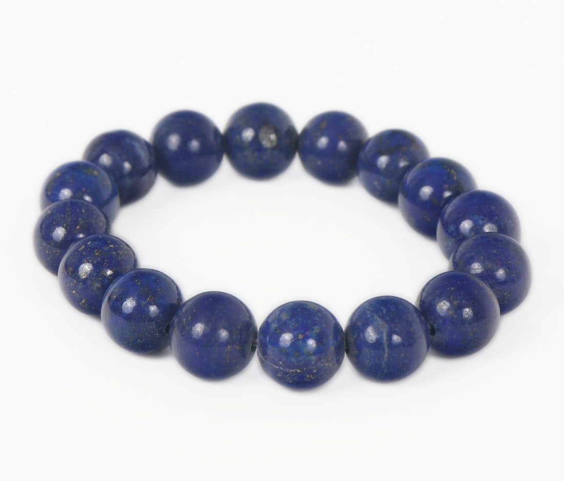 Gorgeous All Natural Lapis Lazuli Beaded Bracelet, 57 grams: Beautiful all natural lapis lazuli beaded bracelet with gorgeous natural gold and silver ripples throughout each bead that sparkle in natural light. Comprised of 17 perfectly polished spherical beads 