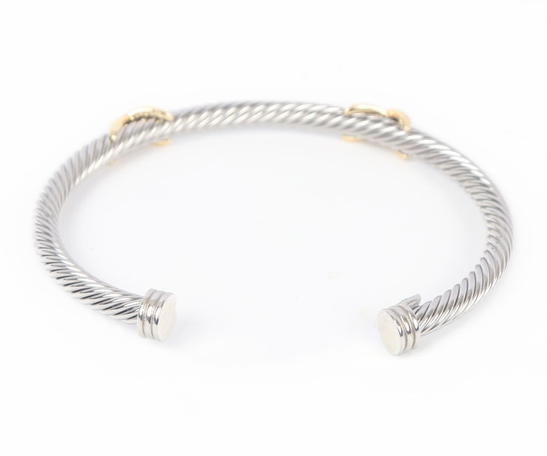 Beautiful David Yurman Style Bracelet: Lovely David Yurman style bracelet in a twisted rope form with two gold style X wraps across the top. Marked D.Y. 925 750. Included with a David Yurman velvet bag and a David Yurman box. Size 2 1/4"
