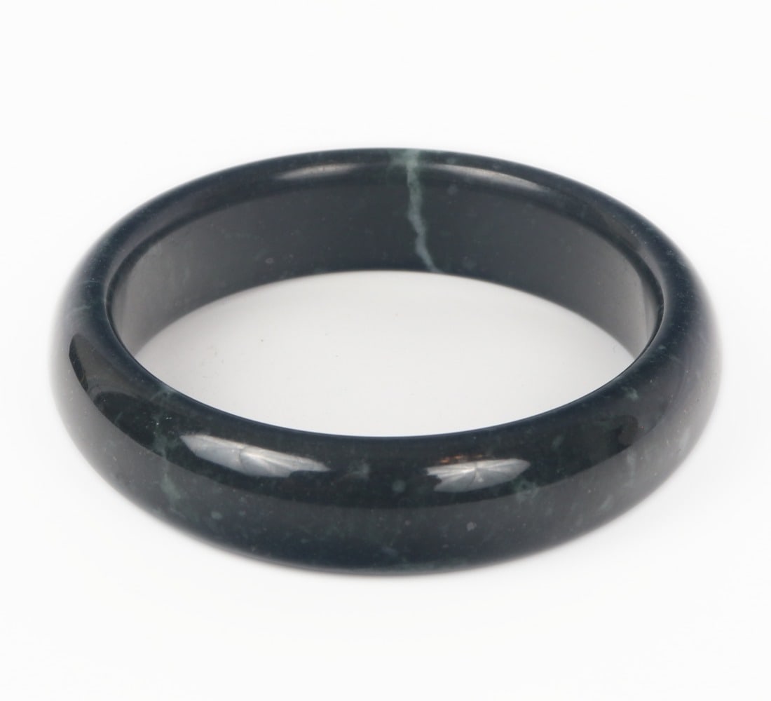 Lovely Obsidian Bangle Bracelet: Beautiful all natural section of obsidian stone carved and polished into a lovely bangle bracelet. Wonderful snow white marbling throughout. Size 2 1/2" W (6.3cm W)