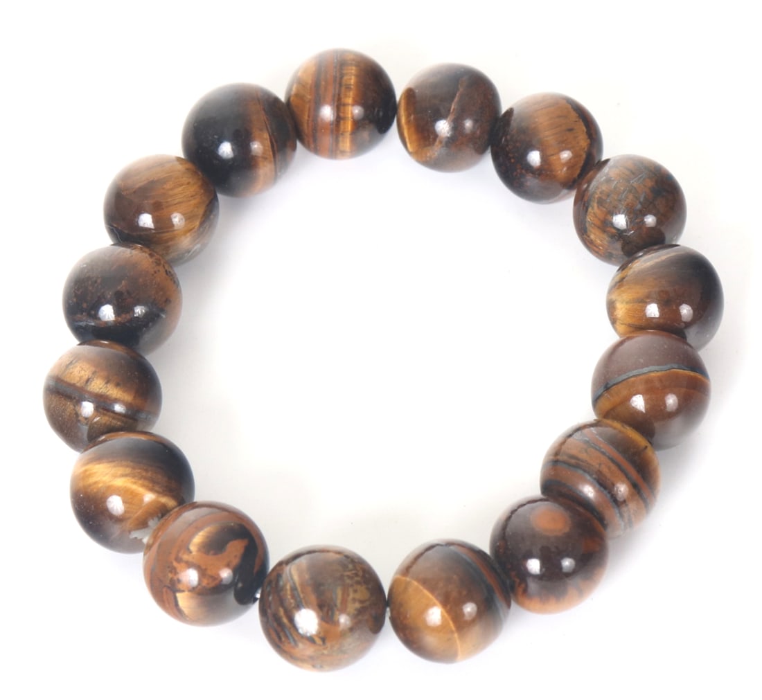 Beautiful Natural Tiger's Eye Beaded Bracelet: Sixteen unique beautifully polished tiger's eye beaded bracelet. Each with unique caramel and gold marbling throughout with the classic cat's eye effect. Size: Elastic band measures 2" W inner