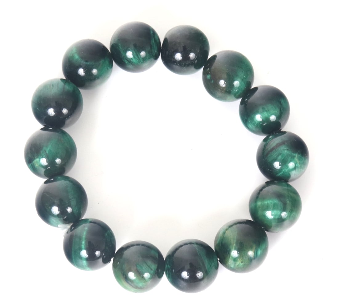 Gorgeous Unique Green Tiger's Eye Beaded Bracelet: Gorgeous unique green tiger's eye beaded bracelet, comprised of fourteen incredible beads. Each with the classic cat's eye effect with bright silvered green bands. Size: Elastic band measures 2" W