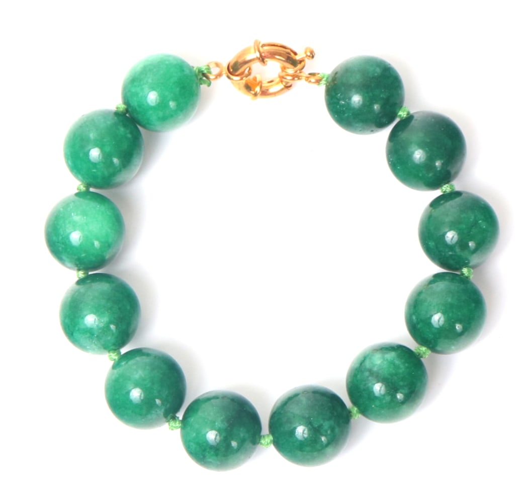 Wonderful Chinese Jade Style Beaded Bracelet: Gorgeous bright emerald green Chinese jade colored beaded bracelet comprised of twelve unique jade style beads. Each with natural lovely clouds and stripes in various shades of green. Size: End to