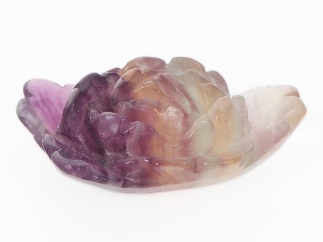 Lovely Rose Carved Rainbow Tourmaline Specimen: Gorgeous rainbow tourmaline mineral specimen carved in a beautiful petite rose. Purple, yellow, green and light blue colors glow in natural sunlight. Size 3 1/4" L