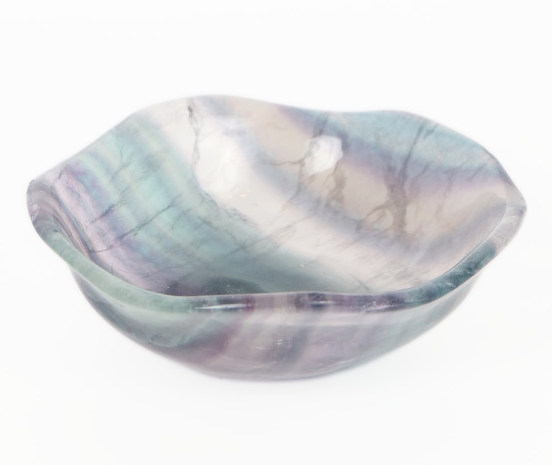 Beautiful Rainbow Flourite Scalloped Bowl: Lovely polished section of rainbow flourite carved in a perfect little bowl. Rim in a scallop or petal like shape. Wonderful colors throughout including sea green and purple with a clear white band.