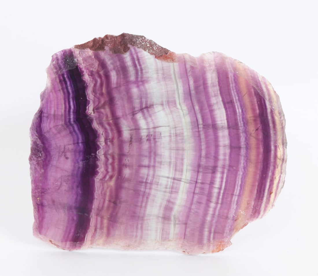 Gorgeous All Natural Rainbow Fluorite Slab: Wonderful all natural rainbow fluorite mineral slab. Displaying a stunning array of natural deep purples leading to a lovely sea green in natural light. Casting rainbows when displayed on a mantel or