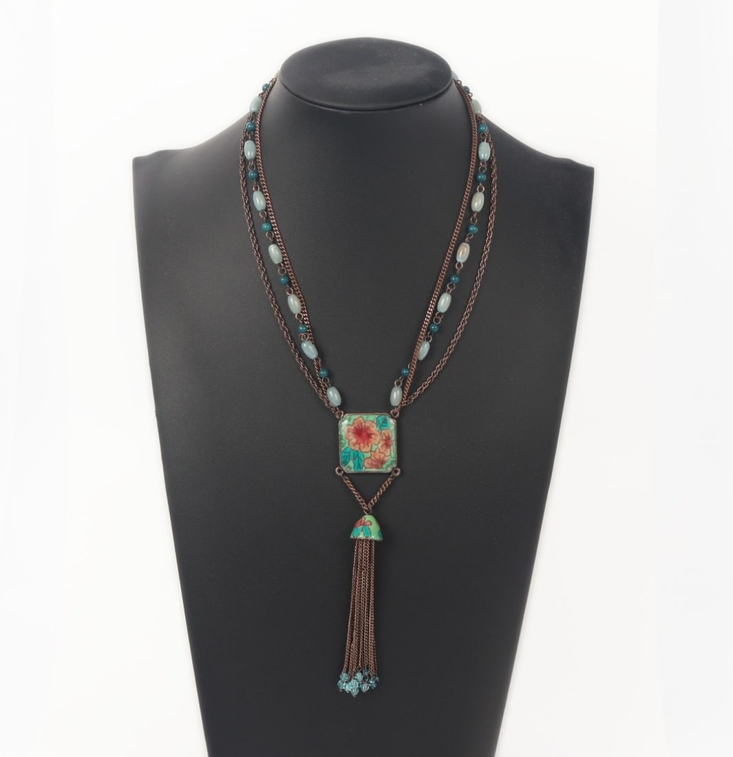 Gorgeous Vintage Enameled Pendant Necklace: Lovely unique vintage necklace with a square enamaled pendant with peach colored flowers to the face, a star in high relief to the back. Enameled bell suspended below the pendant with dozens of