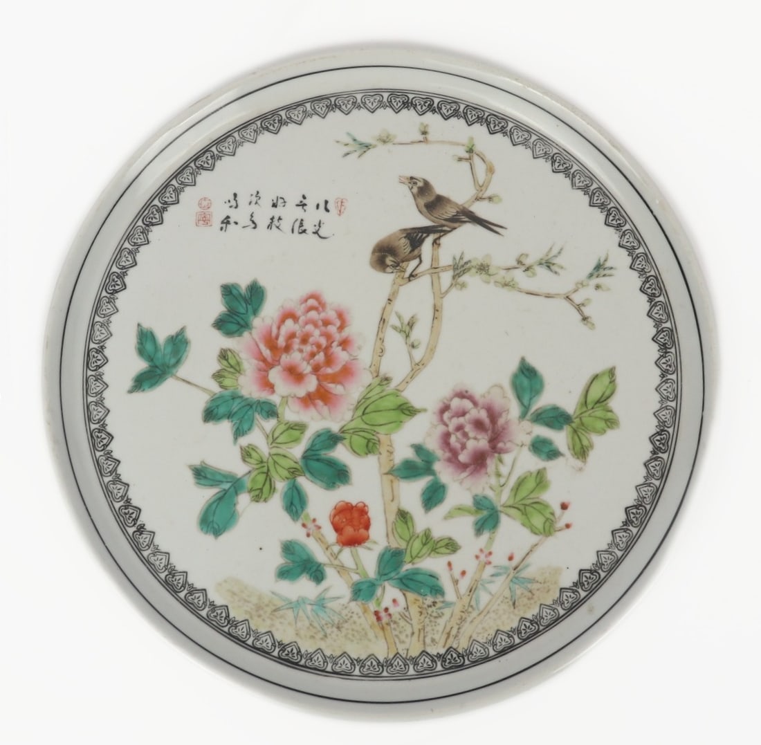 Chinese Famille Rose Porcelain Plate: Chinese porcelain famille rose painted plate with two birds perched on a tree branch. Beautiful flowers in bloom in light pink, red and purple. Calligraphy and seal marks to the upper right. Size 10"
