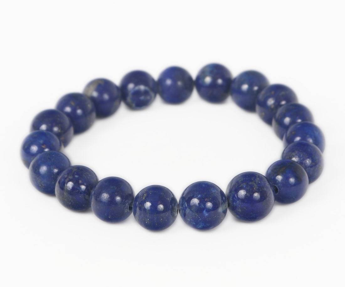 Beautiful All Natural Lapis Lazuli Beaded Bracelet , 39 grams: Gorgeous all natural lapis lazuli beaded bracelet comprised of 19 gorgeous polished spherical beads. Wonderful golden and silver waves throughout each bead that sparkle in the natural light. Size 2
