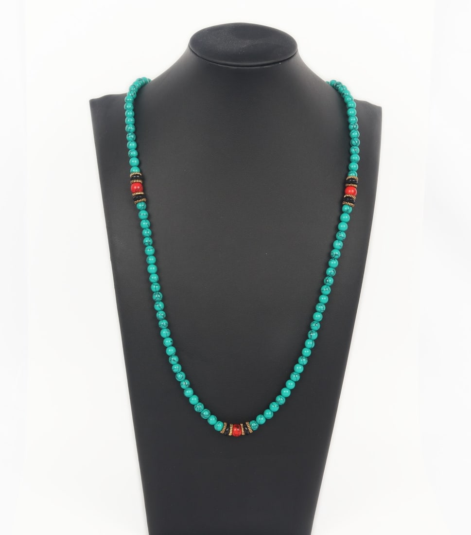 Light Green Turquoise Beaded Rosary: Beautiful beaded turquoise rosary necklace with red, copper and black colored accent beads. Strung together on a beautiful bright yellow silk thread. Size 27" L (68.6cm L)