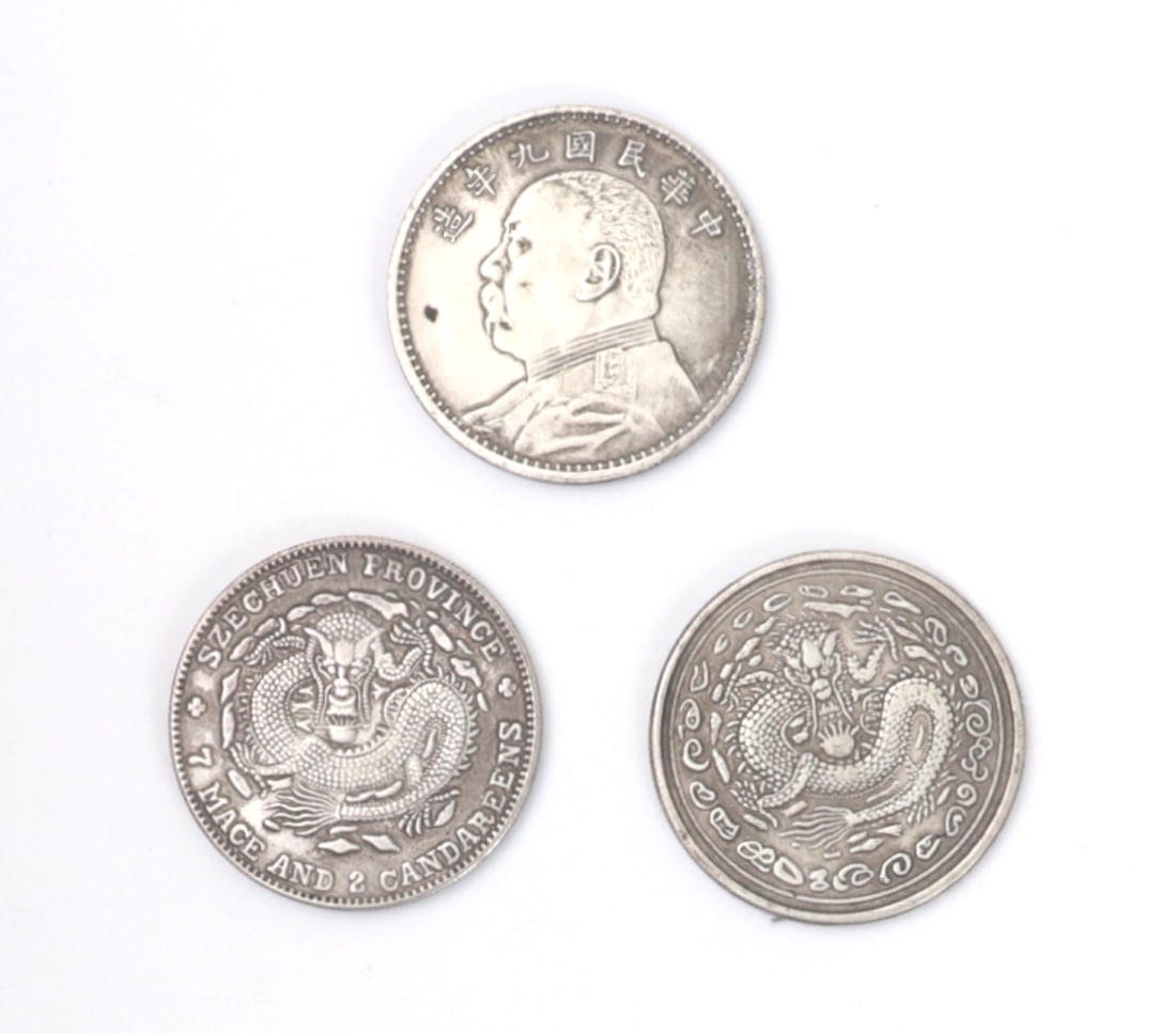 Chinese Silver Style Coins, Group of Three: Group lot of three Chinese silver style coins including one Szechuen Province style coin with a hovering five clawed dragon in high detail, and another coin featuring a five clawed dragon above a