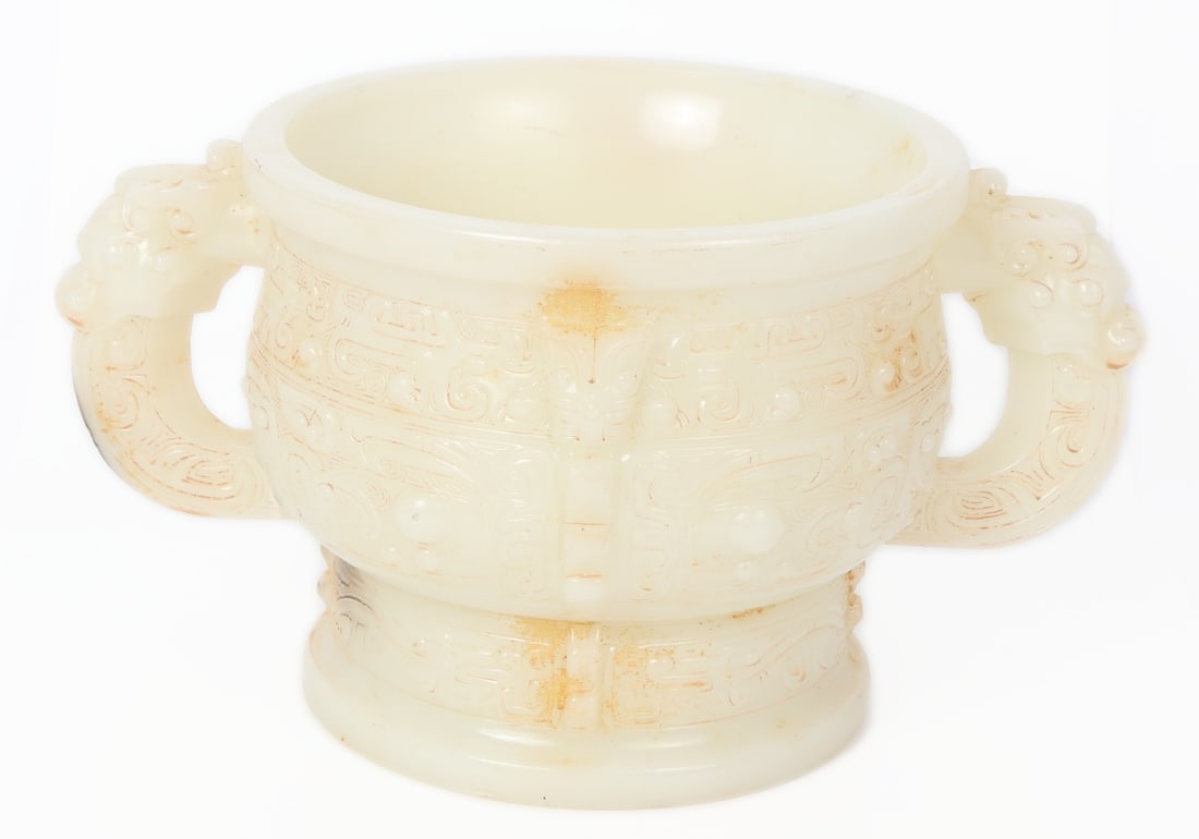 Heavy Chinese Hardstone Censer with Dragon Handles: Heavy white hardstone jade style Chinese censer. Detailed throughout in high relief with zoomorphic faces and figures around the body. Geographic repeated banding in between each design around the