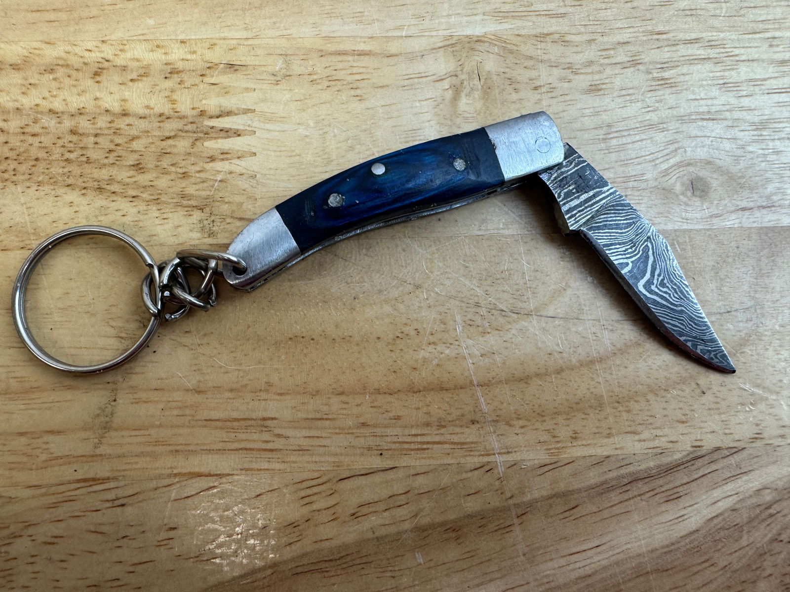 Beautiful Handmade Damascus Steel KeyChain Folding Knife: Beautiful Handmade Damascus Steel KeyChain Folding Knife. See photos for details and measurements. Meticulously crafted by skilled artisans, each knife is forged from multiple layers of high-carbon st