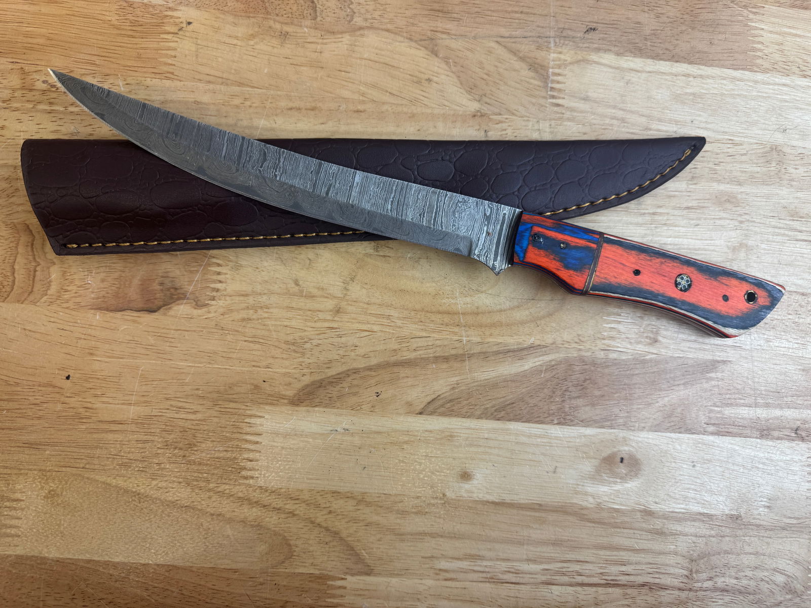 Beautiful Handmade Damascus Steel Filet Knife w/Sheath: Beautiful Handmade Damascus Steel Filet Knife w/Sheath. See photos for details and measurements. Meticulously crafted by skilled artisans, each knife is forged from multiple layers of high-carbon stee