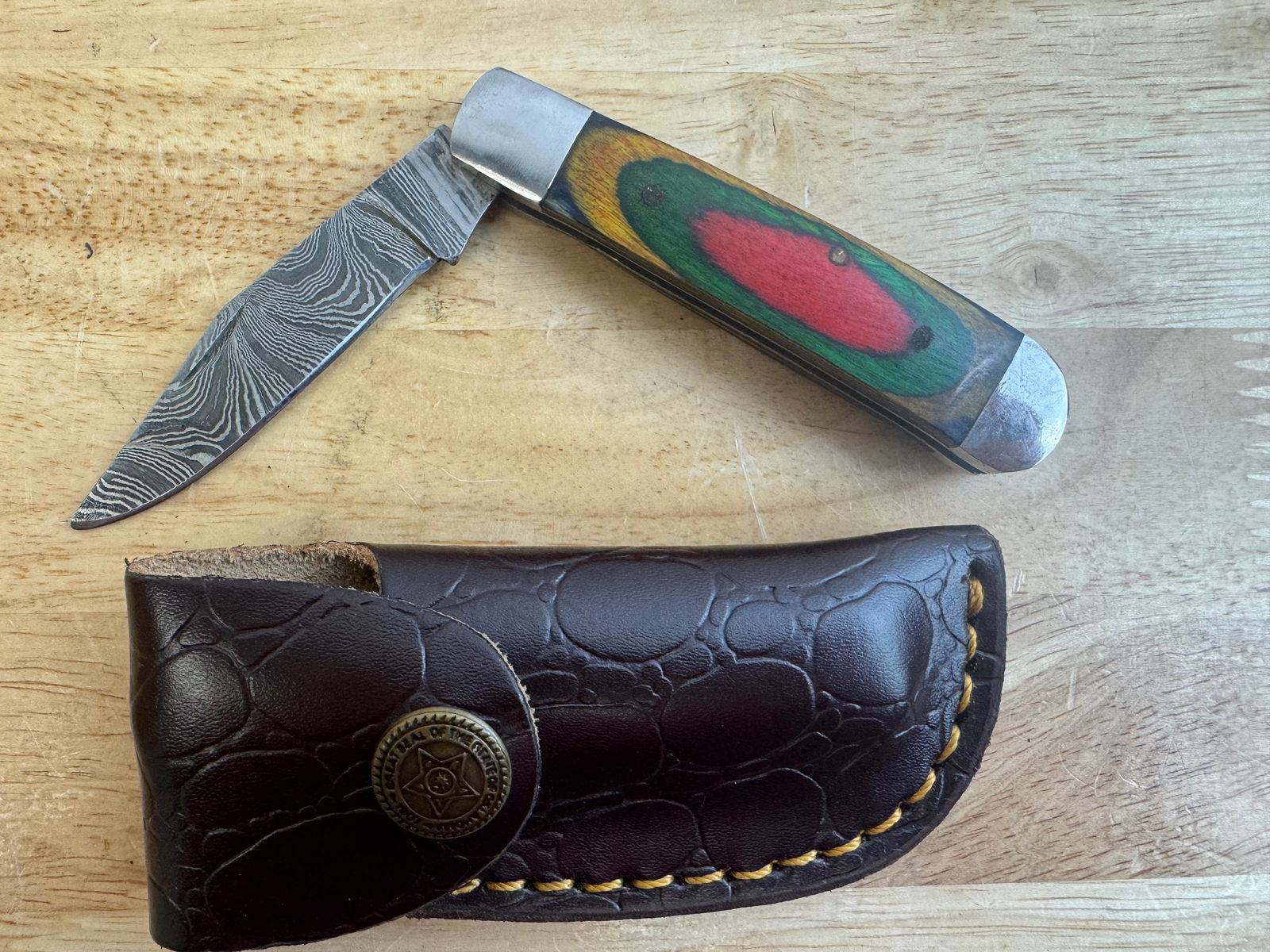 Beautiful Handmade Damascus Steel Folding Knife w/Sheath: Beautiful Handmade Damascus Steel Folding Knife w/Sheath. See photos for details and measurements. Meticulously crafted by skilled artisans, each knife is forged from multiple layers of high-carbon st